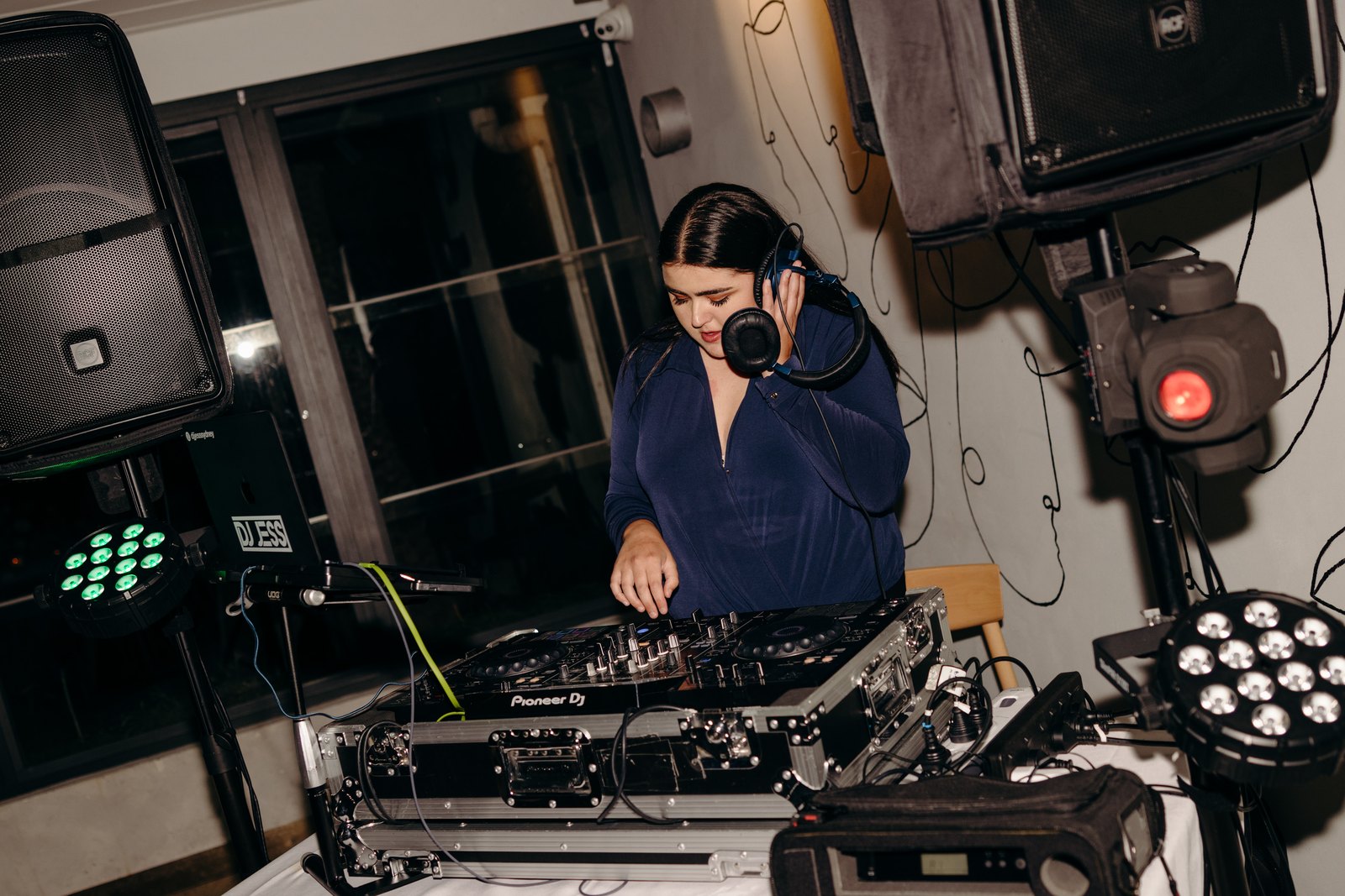 DJ Jess at the decks during a reception