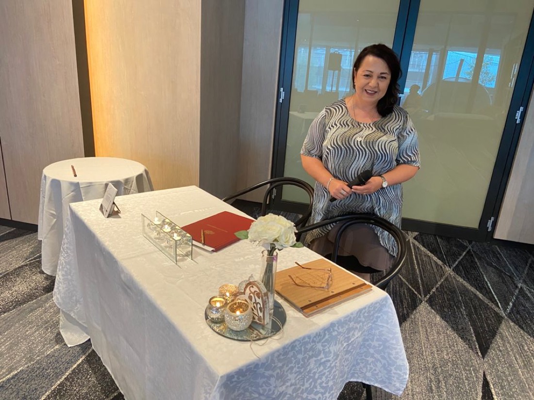 Josephine at the signing table before a ceremony
